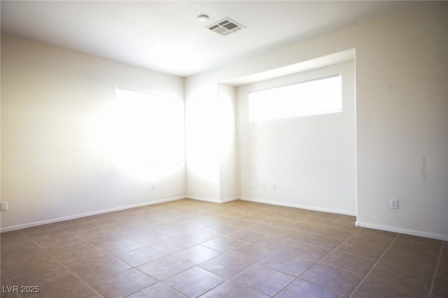3652 Remington Grove Ave, North Las Vegas, NV 89081 - spare room featuring tile patterned floors, visible vents, and baseboards