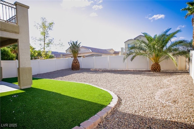 3652 Remington Grove Ave, North Las Vegas, NV 89081 - view of yard with a fenced backyard and a balcony