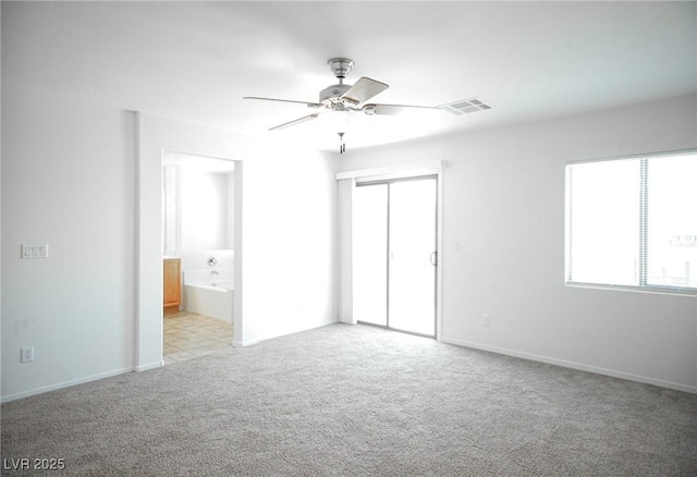 3652 Remington Grove Ave, North Las Vegas, NV 89081 - interior space with light colored carpet, visible vents, a closet, a ceiling fan, and ensuite bath