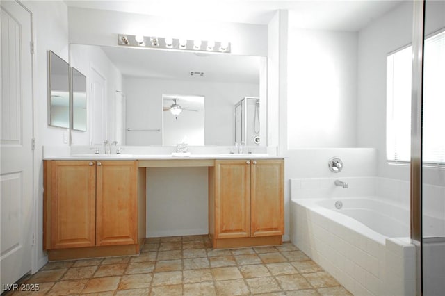 3652 Remington Grove Ave, North Las Vegas, NV 89081 - bathroom featuring double vanity, ceiling fan, a bath, and a sink