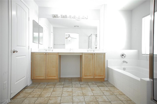 3652 Remington Grove Ave, North Las Vegas, NV 89081 - bathroom featuring double vanity, stone finish flooring, a stall shower, a garden tub, and a ceiling fan