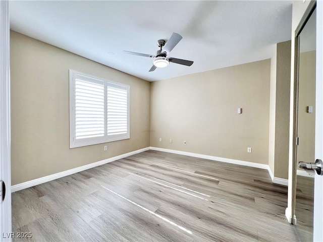 8070 W Russell Rd Unit 2070, Las Vegas, NV 89113 - spare room with a ceiling fan, wood finished floors, and baseboards