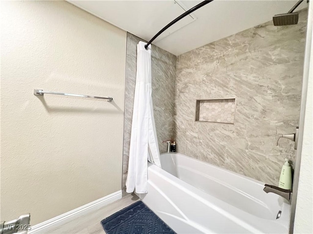 8070 W Russell Rd Unit 2070, Las Vegas, NV 89113 - bathroom featuring shower / bathtub combination with curtain and baseboards