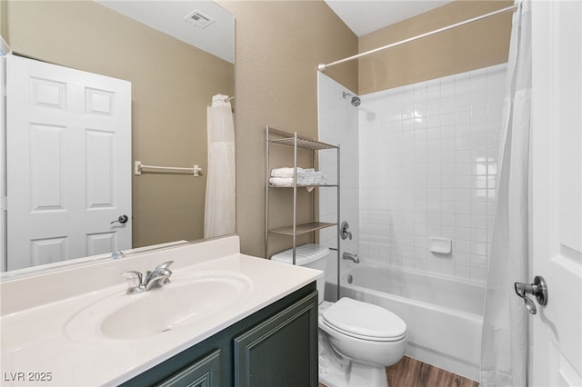 full bathroom featuring wood finished floors, vanity, toilet, and shower / bath combination with curtain