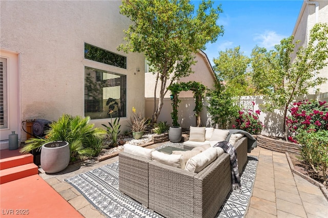 view of patio with fence and an outdoor living space