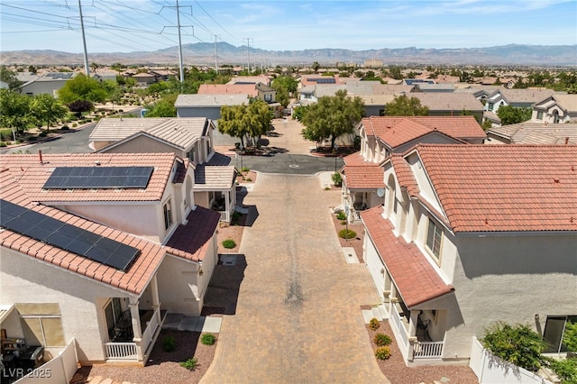 birds eye view of property with a mountain view and a residential view