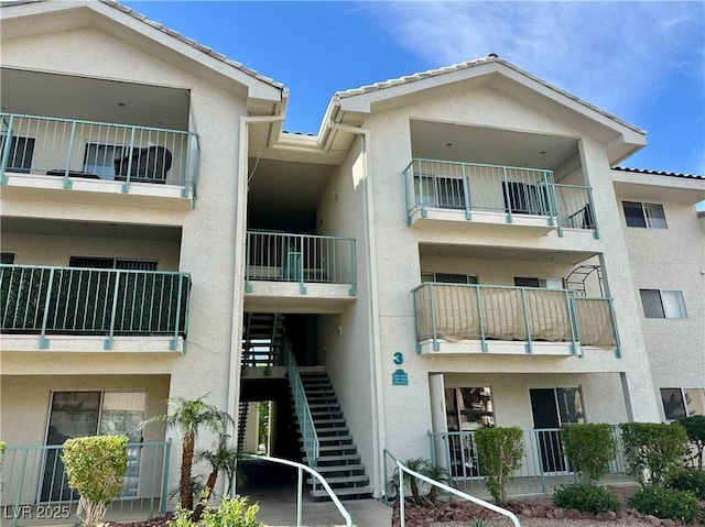 view of property featuring stairway