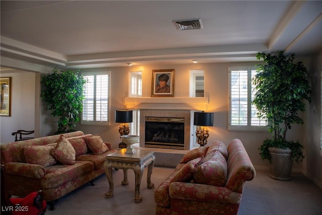 9905 Fox Springs Dr, Las Vegas, NV 89117 - carpeted living area with a tile fireplace, healthy amount of natural light, and a raised ceiling