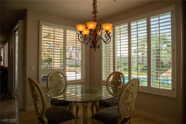 9905 Fox Springs Dr, Las Vegas, NV 89117 - dining space with a chandelier and baseboards