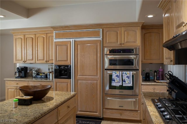 9905 Fox Springs Dr, Las Vegas, NV 89117 - kitchen with a warming drawer, paneled built in fridge, stainless steel double oven, light stone countertops, and light brown cabinets