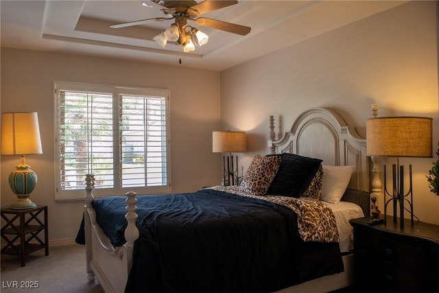 9905 Fox Springs Dr, Las Vegas, NV 89117 - bedroom with carpet floors, a tray ceiling, ceiling fan, and baseboards