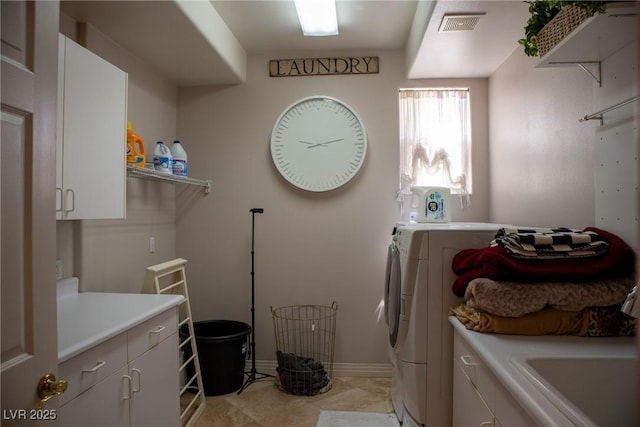9905 Fox Springs Dr, Las Vegas, NV 89117 - clothes washing area featuring cabinet space, independent washer and dryer, and baseboards