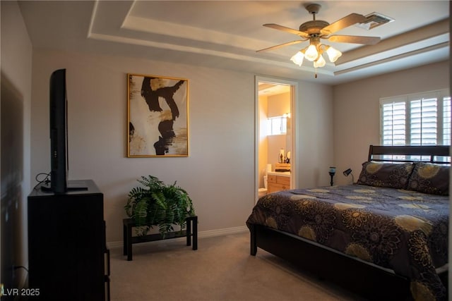 9905 Fox Springs Dr, Las Vegas, NV 89117 - carpeted bedroom with a raised ceiling, ensuite bathroom, baseboards, and ceiling fan
