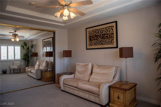 9905 Fox Springs Dr, Las Vegas, NV 89117 - living room with a raised ceiling, a ceiling fan, and carpet