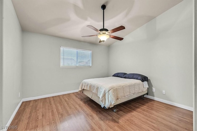 2805 El Cubano Ct, North Las Vegas, NV 89030 - bedroom with baseboards, a ceiling fan, wood finished floors, and lofted ceiling