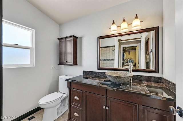 2805 El Cubano Ct, North Las Vegas, NV 89030 - bathroom featuring vanity, tile patterned flooring, and toilet