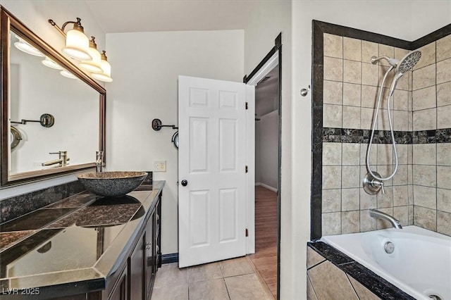 2805 El Cubano Ct, North Las Vegas, NV 89030 - full bathroom featuring vanity, baseboards, tile patterned floors, and tiled shower / bath combo