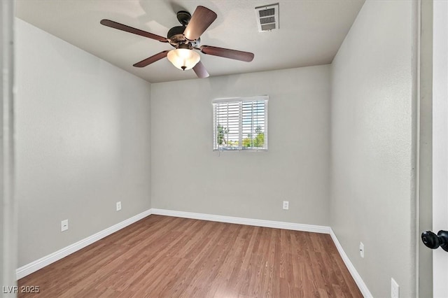 2805 El Cubano Ct, North Las Vegas, NV 89030 - spare room with baseboards, a ceiling fan, wood finished floors, and visible vents