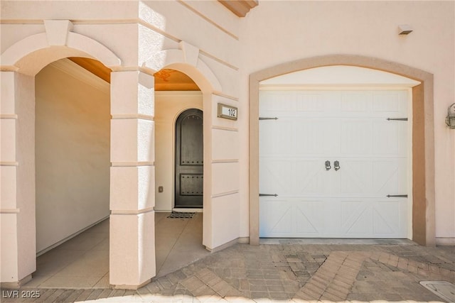 property entrance with a garage
