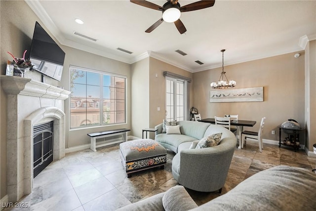 tiled living room with visible vents, ceiling fan with notable chandelier, crown molding, and a fireplace