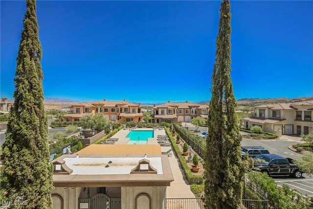 view of pool with a residential view