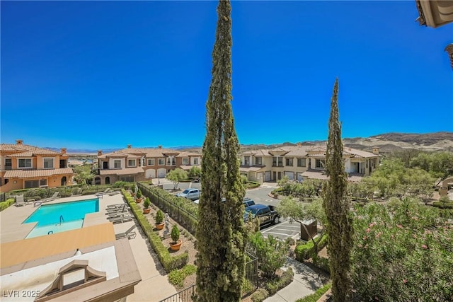 pool featuring a residential view and a mountain view