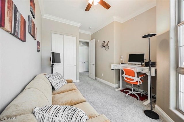 home office with ornamental molding, a ceiling fan, carpet floors, and baseboards