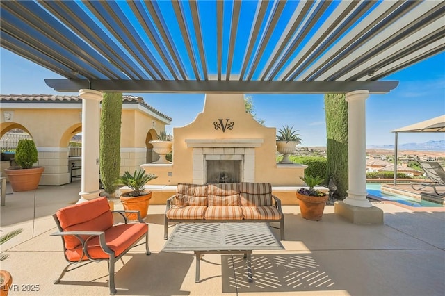 view of patio / terrace featuring an outdoor living space with a fireplace