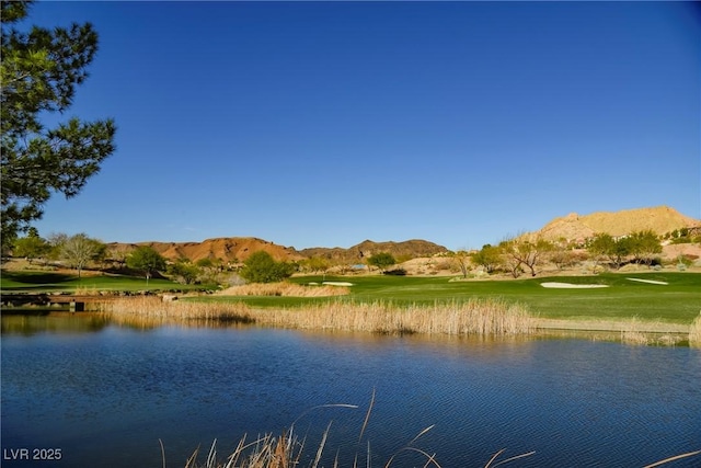 property view of water featuring a mountain view and golf course view
