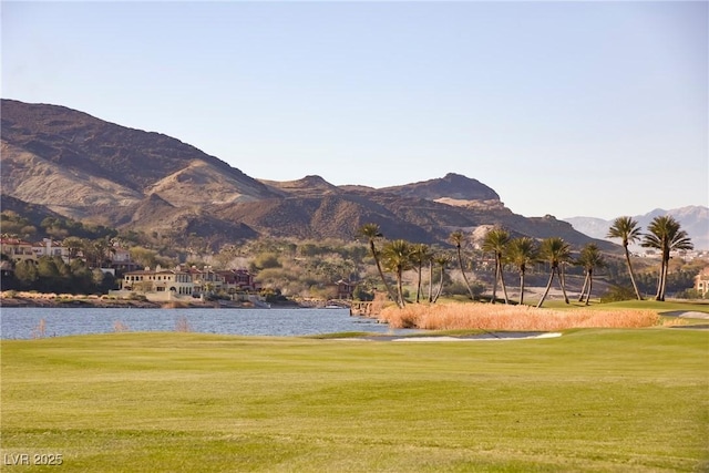 view of mountain feature featuring a water view and golf course view