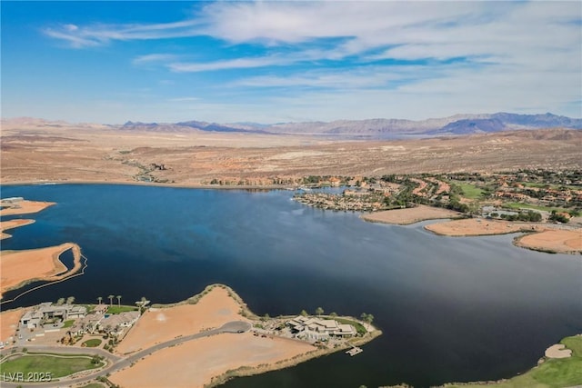 drone / aerial view with a water and mountain view
