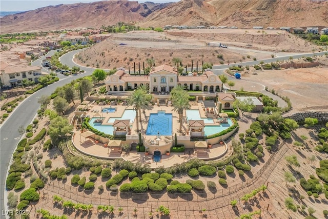 birds eye view of property with a mountain view