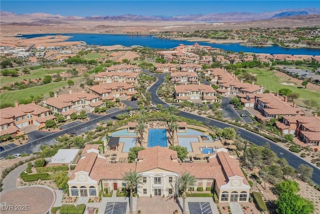 birds eye view of property featuring a water and mountain view, a residential view, and golf course view