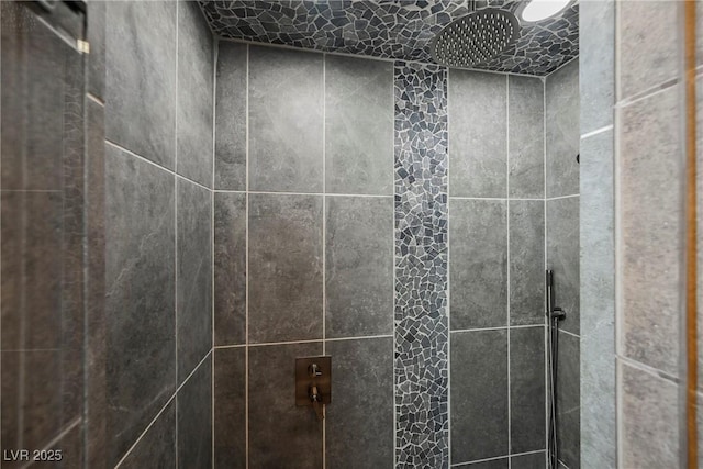 details with a tile shower