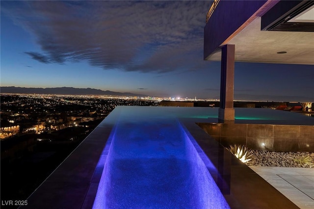 811 Magnum Cliff Ct, Henderson, NV 89012 - view of pool with a mountain view