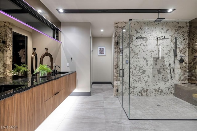 811 Magnum Cliff Ct, Henderson, NV 89012 - bathroom featuring recessed lighting, baseboards, a sink, a shower stall, and double vanity