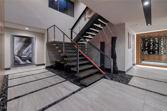 811 Magnum Cliff Ct, Henderson, NV 89012 - staircase featuring marble finish floor, baseboards, and recessed lighting