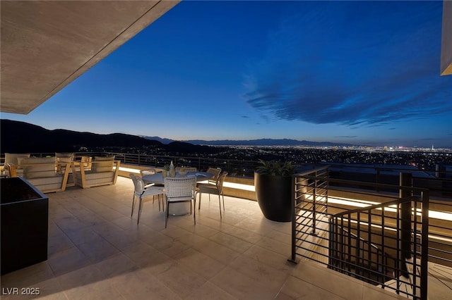 811 Magnum Cliff Ct, Henderson, NV 89012 - view of patio / terrace with outdoor dining space and a mountain view