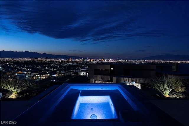 811 Magnum Cliff Ct, Henderson, NV 89012 - view of pool with an in ground hot tub and a mountain view