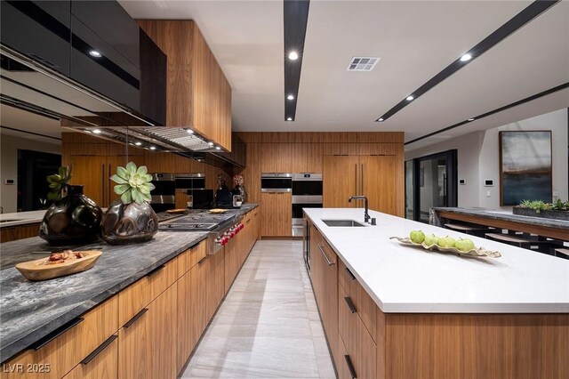 811 Magnum Cliff Ct, Henderson, NV 89012 - kitchen with modern cabinets, stainless steel appliances, and a sink