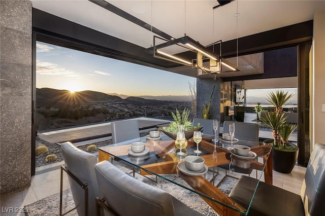 811 Magnum Cliff Ct, Henderson, NV 89012 - dining room featuring an inviting chandelier and a mountain view