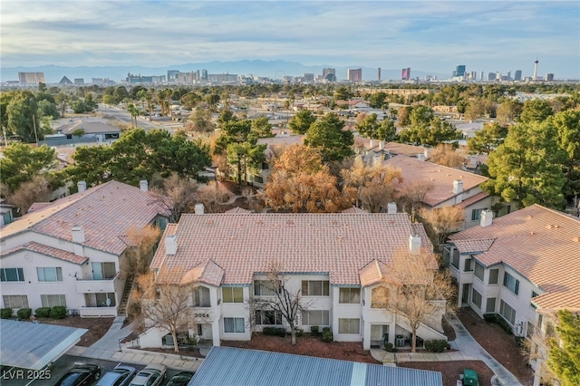 drone / aerial view with a residential view and a city view