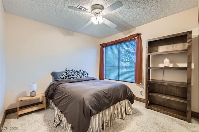 9921 Heffner Hills Cir, Las Vegas, NV 89117 - carpeted bedroom featuring baseboards, a textured ceiling, ceiling fan, and visible vents