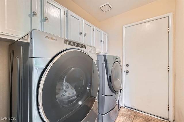 9921 Heffner Hills Cir, Las Vegas, NV 89117 - laundry room with visible vents, cabinet space, and independent washer and dryer
