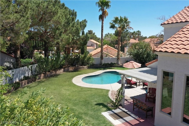 9921 Heffner Hills Cir, Las Vegas, NV 89117 - view of pool with a patio, a fenced backyard, a fenced in pool, a lawn, and a residential view
