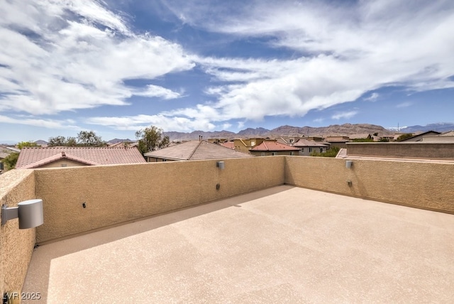 view of patio / terrace featuring a mountain view