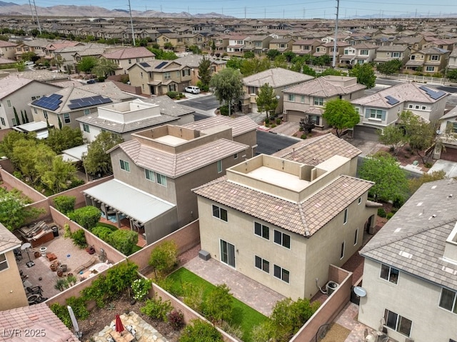 birds eye view of property with a residential view and a mountain view