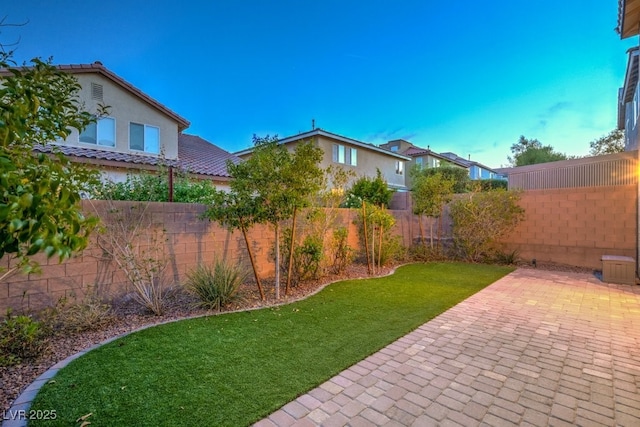 view of yard featuring a fenced backyard and a patio area