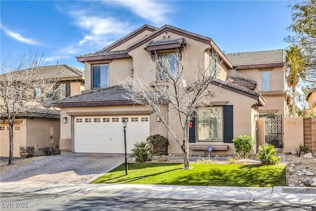 view of front facade with driveway, a garage, stucco siding, and fence