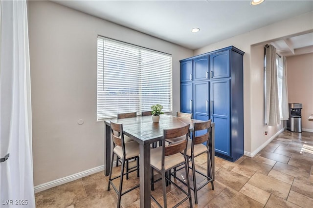 dining space with recessed lighting and baseboards